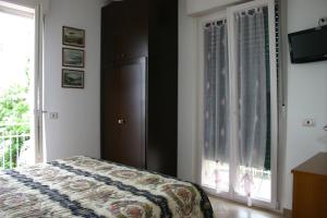 A bed or beds in a room at B&B La Baia Di Fiascherino citr01101sei-BEB-0011