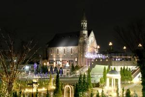 a large church with christmas lights in front of it at Hotel Sunlife Garden in Hiratsuka