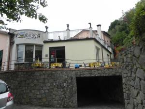 a building on top of a stone wall at Hotel Il Saraceno in Volastra