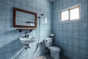 Koupelna v ubytování Jia Lin Homestay + 14 fotografií