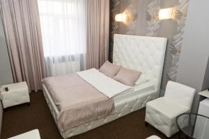 Postel nebo postele na pokoji v ubytování Hotel Marton Business