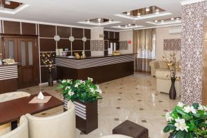 a hotel lobby with a reception desk and a lobby at Hotel Marton Business in Voronezh