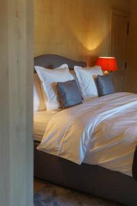 Postel nebo postele na pokoji v ubytování Boutique Hotel De Brakelhoen