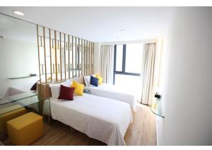 Letto o letti in una camera di IW Hotel