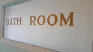 a sign that reads bath room on a wall at Station Hotel in Hucknall