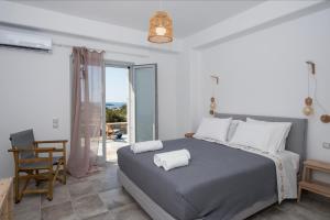 Ένα ή περισσότερα κρεβάτια σε δωμάτιο στο Villa Theros