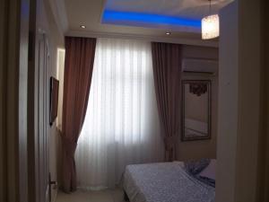 Ένα ή περισσότερα κρεβάτια σε δωμάτιο στο Royal 5 Mutlu