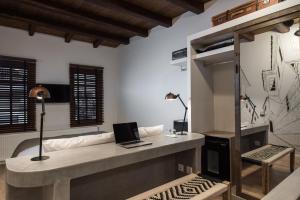 a room with a desk with a laptop on it at Olganos VL Luxury Rooms & Suites in Veria +39 photos