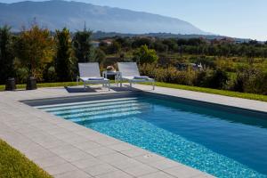 The swimming pool at or close to Villa Lefteris