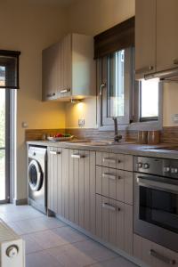 A kitchen or kitchenette at Villa Lefteris
