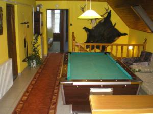 a living room with a pool table in it at Király Nyaraló in Fonyód