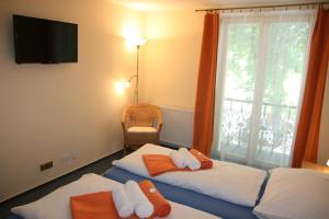 Posteľ alebo postele v izbe v ubytovaní Hotel Praha Potštejn