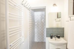 Ванная комната в Central Park by CityLife Suites