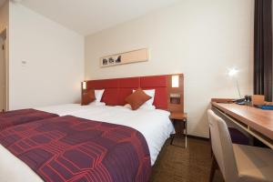 Postel nebo postele na pokoji v ubytování HOTEL MYSTAYS Haneda