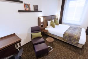 Postel nebo postele na pokoji v ubytování HOTEL MYSTAYS Haneda