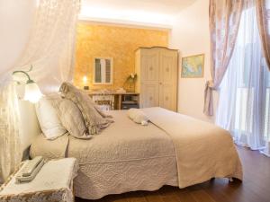 a bedroom with a large bed in a room at Hotel Marina in Monterosso al Mare