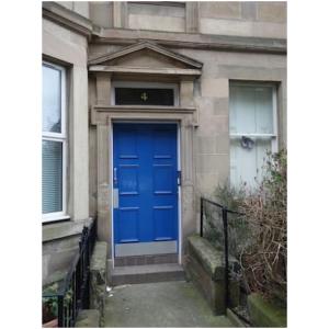 a blue front door of a building with a staircase at Goldenacre Private Room (Homestay) in Edinburgh