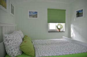 Katil atau katil-katil dalam bilik di Ferienhaus Binz