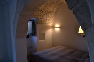 Postel nebo postele na pokoji v ubytování Terrazza Sui Trulli