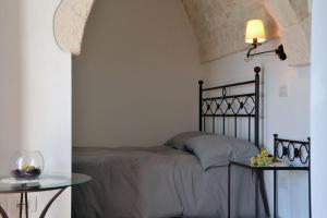 Postel nebo postele na pokoji v ubytování Terrazza Sui Trulli