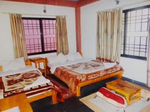 A bed or beds in a room at Hotel Hakoniwa