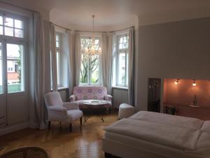 Postel nebo postele na pokoji v ubytování Hotel Heidelberg Astoria