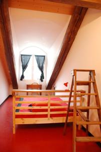 Postel nebo postele na pokoji v ubytování Attic Hostel Torino