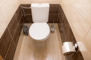 a bathroom with a white toilet in a stall at ŠD Urbánkova 2 in Košice