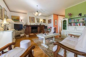 a living room with a couch and a table at Moonshine apartment with magnificent view in Šibenik