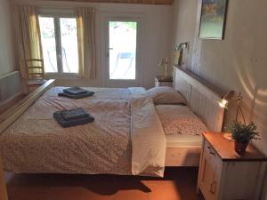 a bedroom with a bed with two towels on it at Spacious holiday home with swimming pool in Villecroze
