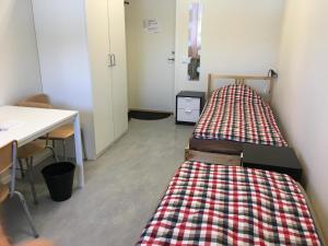 Säng eller sängar i ett rum på Hostel Finnmyrten