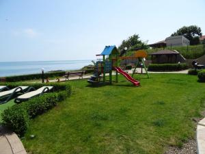 a park with a playground and the ocean in the background at Lozenetz Beach Apartments in Lozenets