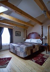 Postel nebo postele na pokoji v ubytování Mackenzie Motel & Cottages
