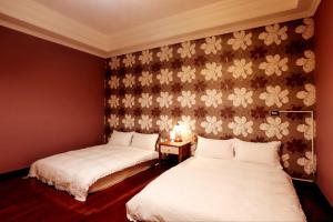 Postel nebo postele na pokoji v ubytování Jia Lin Homestay