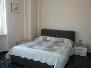 Posteľ alebo postele v izbe v ubytovaní Conte Romita Apartment