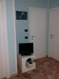 Televízia a/alebo spoločenská miestnosť v ubytovaní Conte Romita Apartment