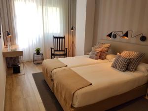 Posteľ alebo postele v izbe v ubytovaní Hotel Boutique Balandret