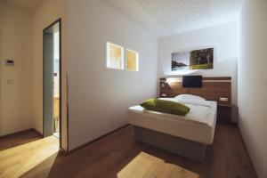 Postel nebo postele na pokoji v ubytování Aparthotel nah dran