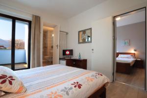 Letto o letti in una camera di Osteria Ticino by Ketty & Tommy
