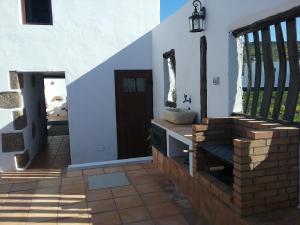 a entrance to a house with a door and a porch at Casa Rural "La Molina" in Máguez