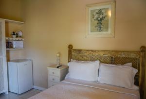 Cama ou camas em um quarto em Pousada Solar da Praia