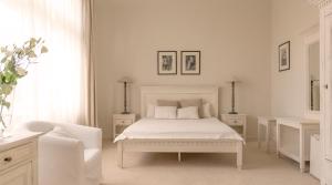 Un pat sau paturi într-o cameră la Villa Modiva