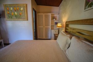 Cama ou camas em um quarto em Pousada Solar da Praia