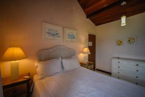 Cama ou camas em um quarto em Pousada Solar da Praia