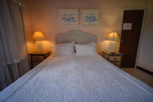 Cama ou camas em um quarto em Pousada Solar da Praia