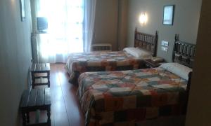 Postel nebo postele na pokoji v ubytování Hotel Casa Aurelia