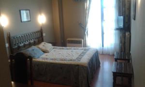 Postel nebo postele na pokoji v ubytování Hotel Casa Aurelia