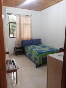 Postel nebo postele na pokoji v ubytování Hotel Orinoco Real