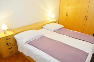 Posteľ alebo postele v izbe v ubytovaní Marin Apartment