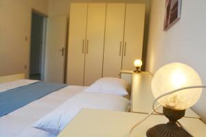 Posteľ alebo postele v izbe v ubytovaní Marin Apartment